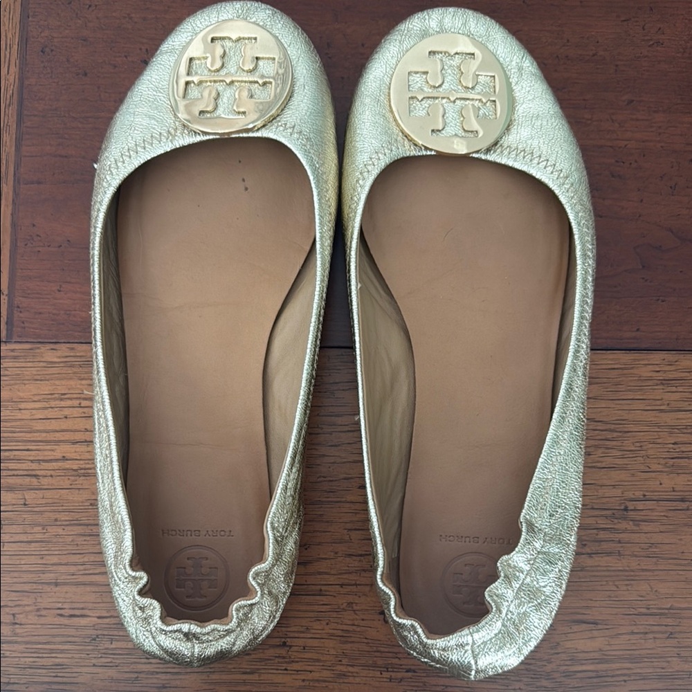 Tory Burch Gold Loafers with Medallion Embellishment